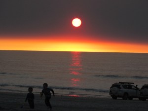 As the sun sinks slowly in the west.