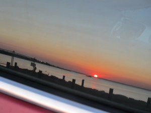 The same sunset reflected in the car window.